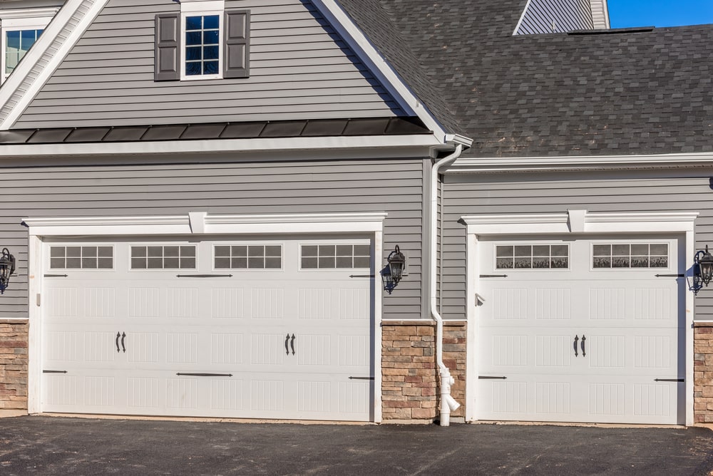 two white residential garage doors - Choosing the Right Garage Door: Residential vs Commercial Doors