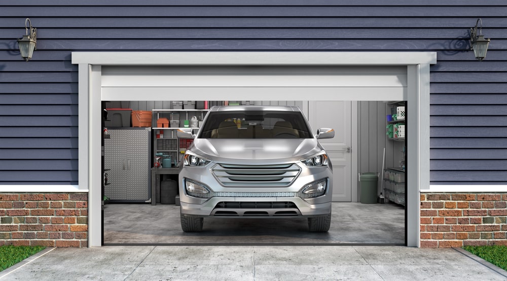 a car backed against a garage door for hurricanes - Protecting Your Garage Door During Hurricane Season