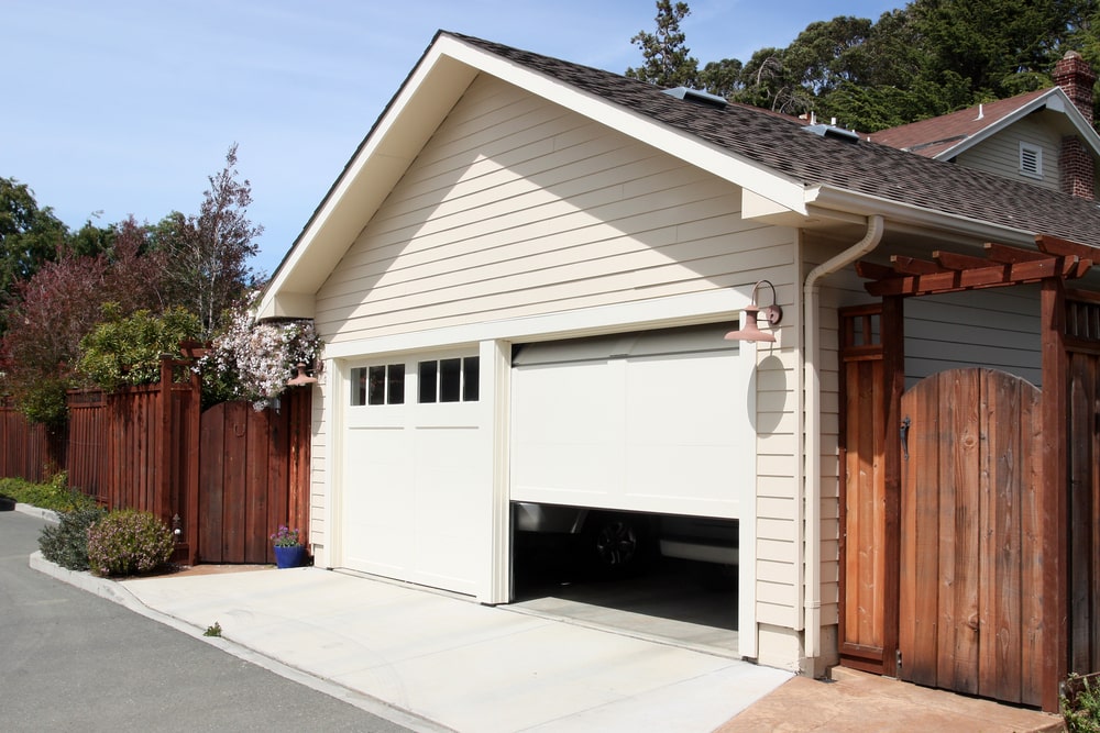 An open garage door revealing the interior, enhancing a suburban home in New Orleans.