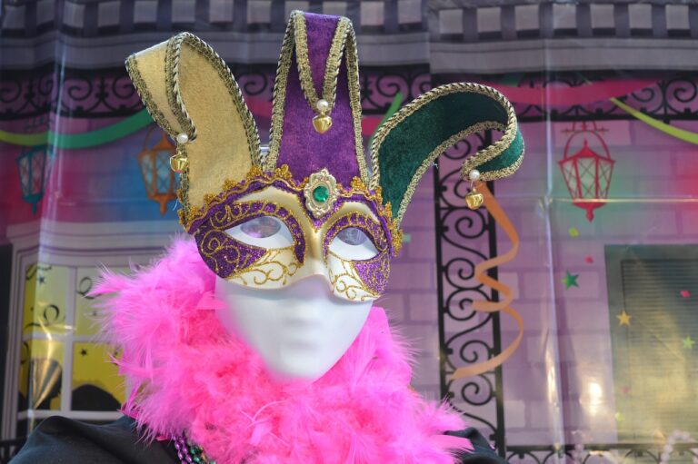 Mardi gras mask in the carnival, decorated house in the background. garage door decoration for mardi gras